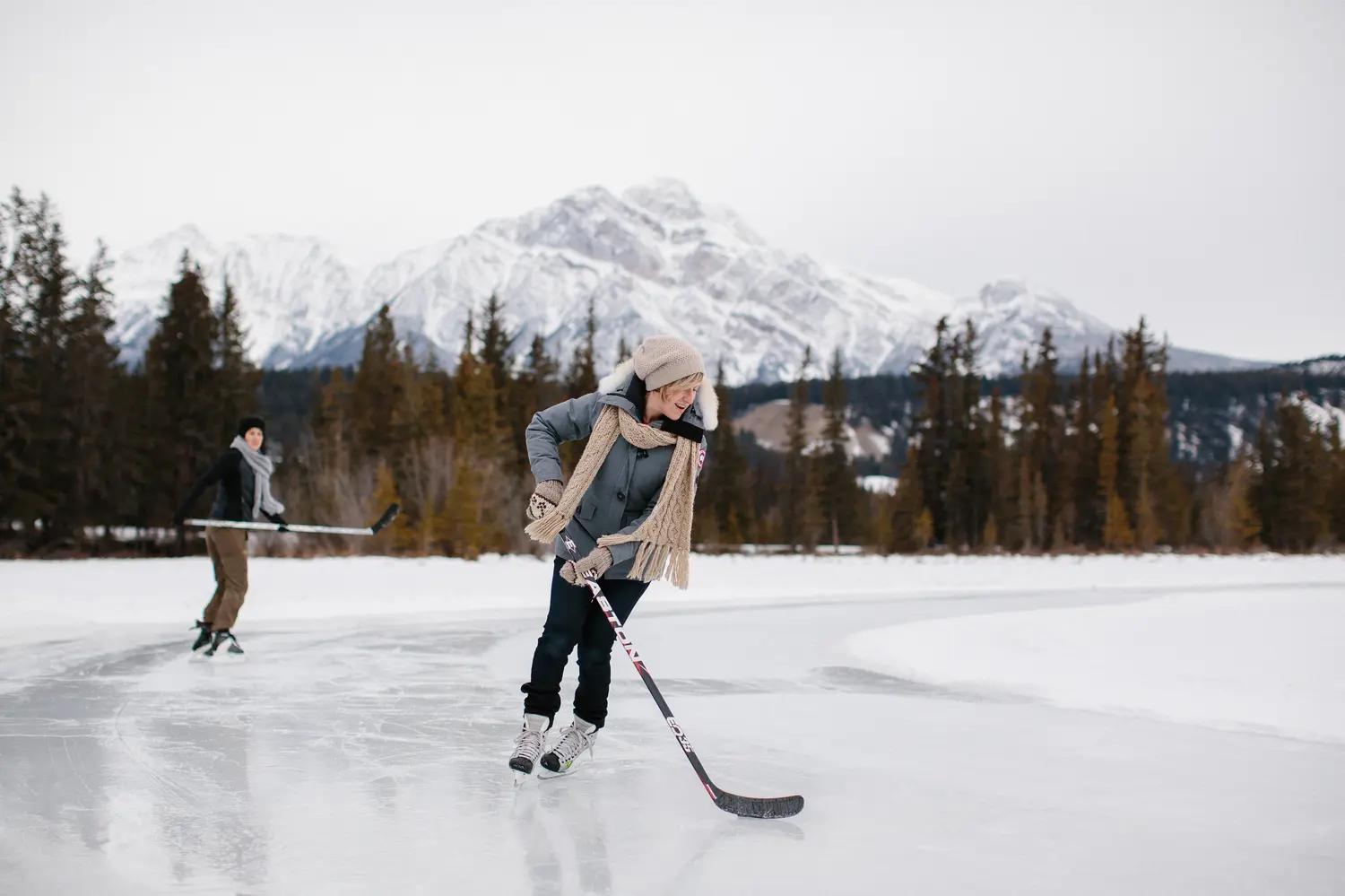 People ice skating on Mildred Lake in Jasper, Canada
