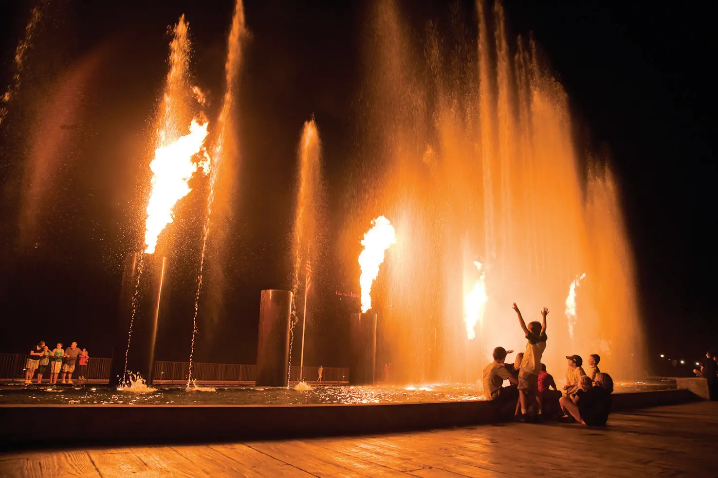 A family enjoying the fountain show at Branson Landing.