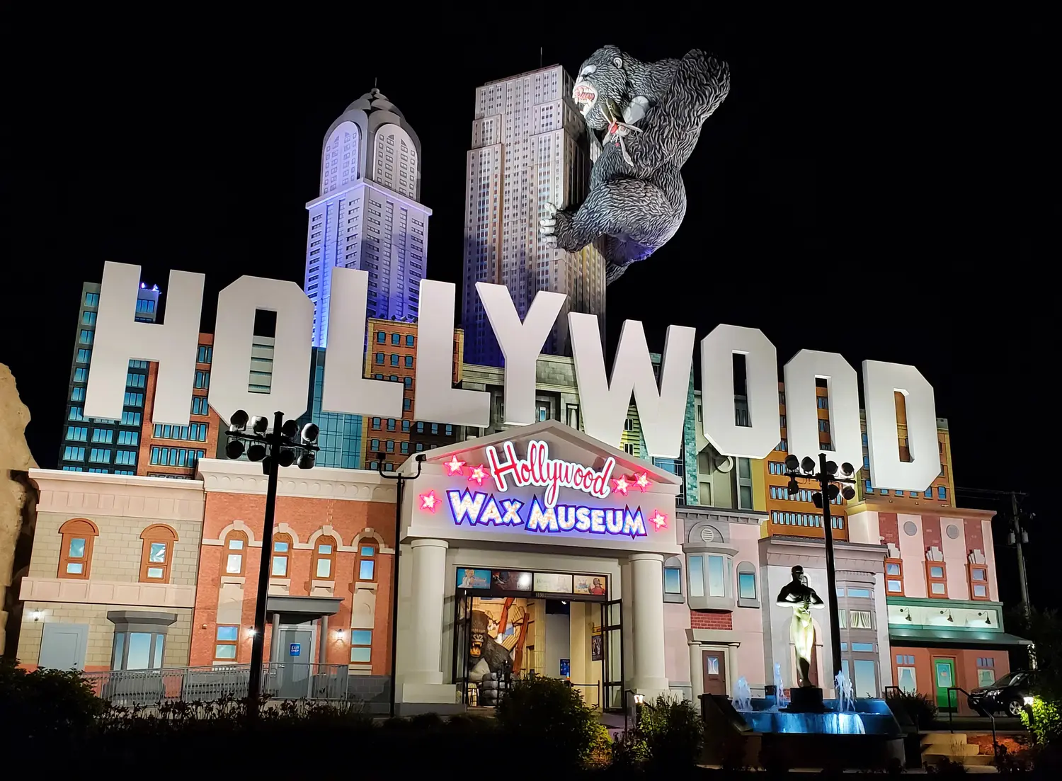 The Hollywood Wax Museum building illuminated at night.